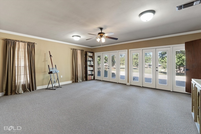 empty room featuring french doors, light colored carpet, ceiling fan, and crown molding