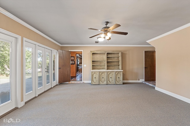 unfurnished living room with ornamental molding, french doors, carpet floors, and ceiling fan