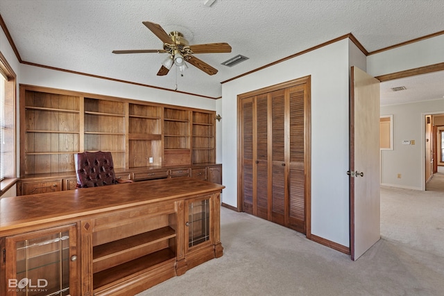 office featuring ceiling fan, a textured ceiling, light carpet, and crown molding