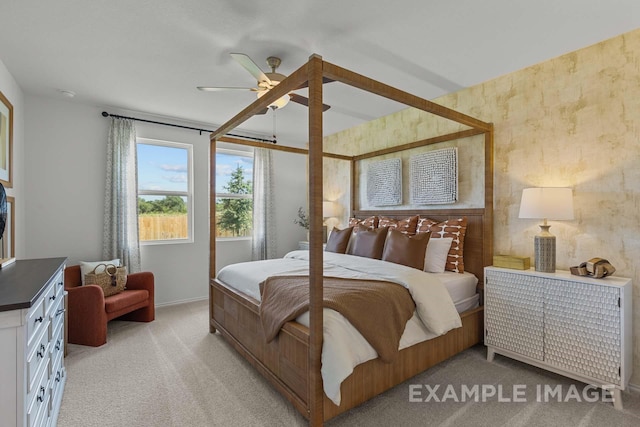 bedroom featuring light carpet, ceiling fan, and wallpapered walls