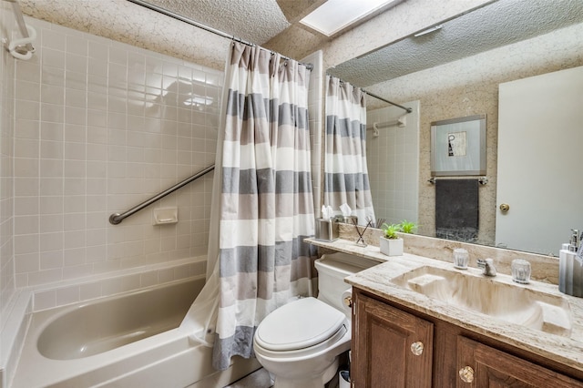 full bathroom with a skylight, vanity, shower / tub combo, and toilet