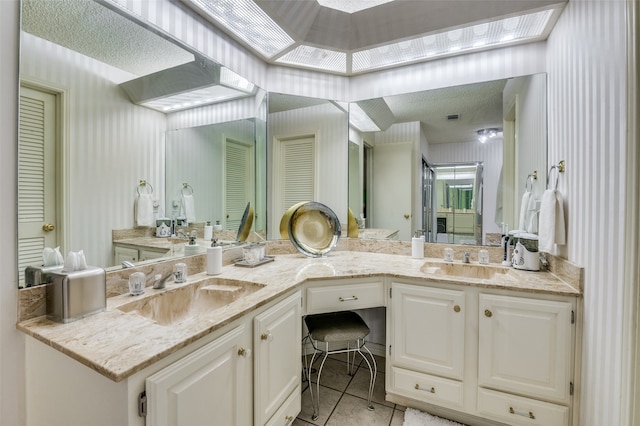 bathroom with tile patterned flooring and vanity