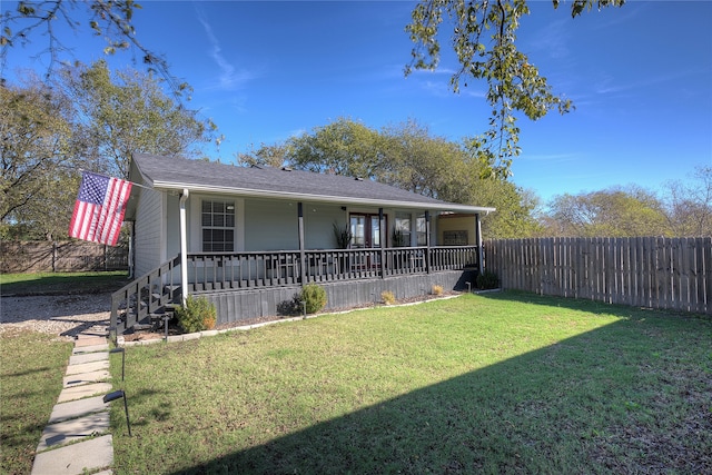 view of front of house featuring a front yard and covered porch