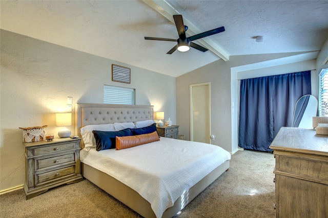 carpeted bedroom with ceiling fan and lofted ceiling with beams