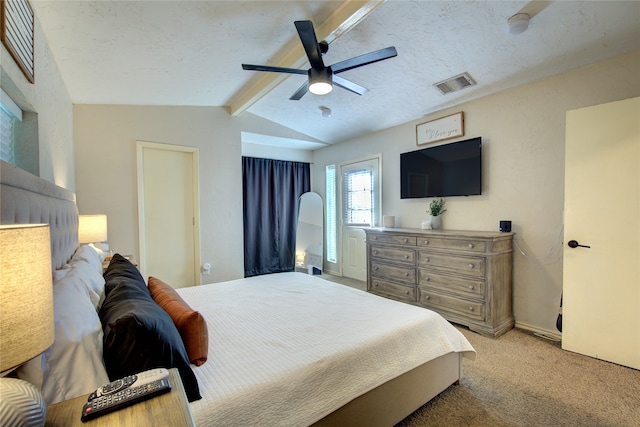 carpeted bedroom with ceiling fan and vaulted ceiling with beams