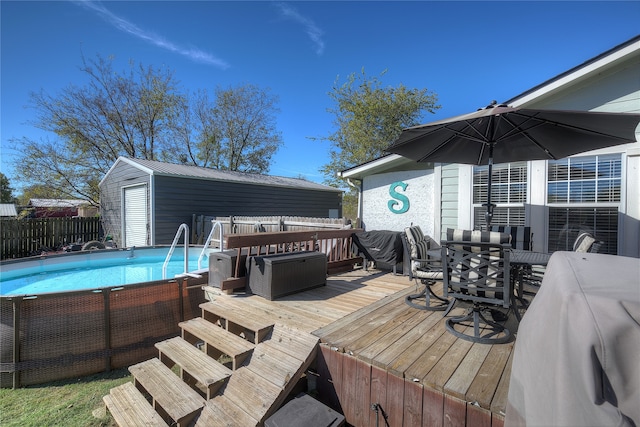 deck with a fenced in pool