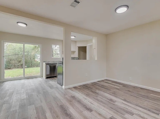 unfurnished living room featuring light wood-type flooring