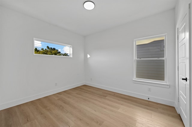 unfurnished room featuring light hardwood / wood-style flooring