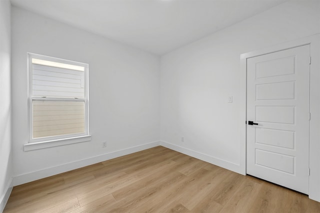 unfurnished room with light hardwood / wood-style floors