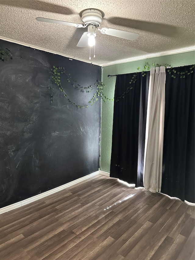 empty room with wood-type flooring, a textured ceiling, and ceiling fan