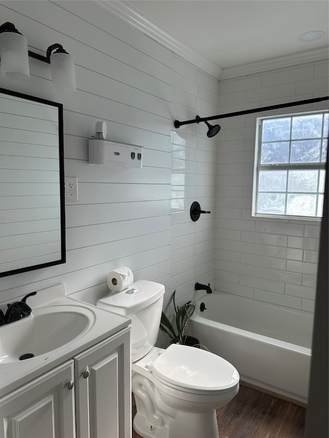 full bathroom featuring hardwood / wood-style floors, vanity, crown molding, wooden walls, and toilet