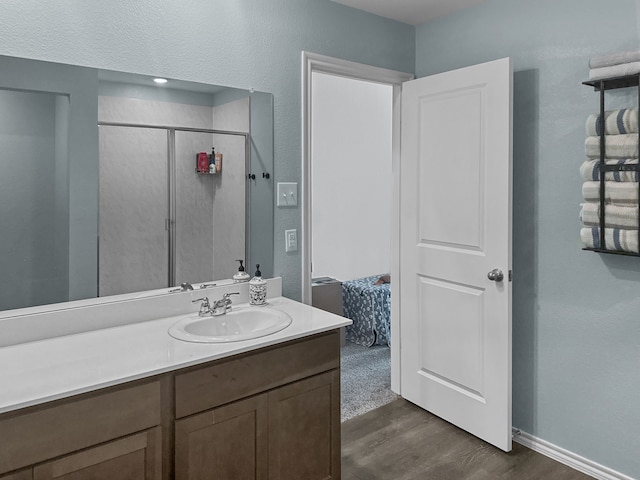 bathroom featuring vanity and wood-type flooring