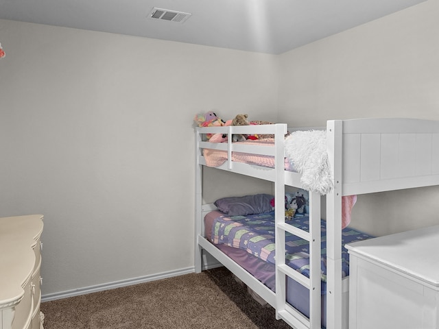 bedroom with dark carpet