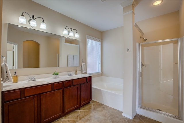 bathroom with ornate columns, vanity, tile patterned floors, and plus walk in shower