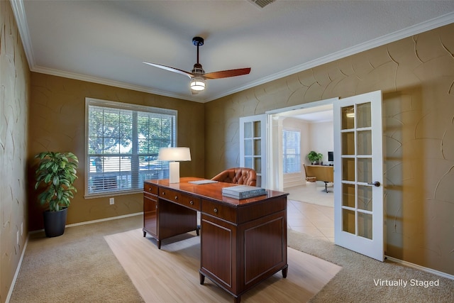 office area with french doors, light carpet, crown molding, and ceiling fan