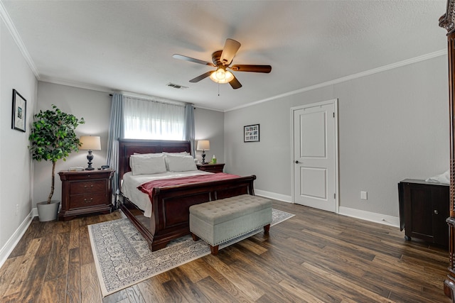 bedroom featuring dark wood-type flooring, ceiling fan, and crown molding