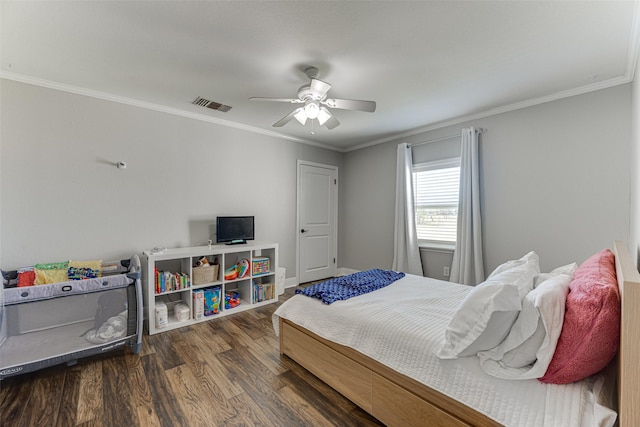 bedroom with ceiling fan, dark wood-type flooring, and ornamental molding