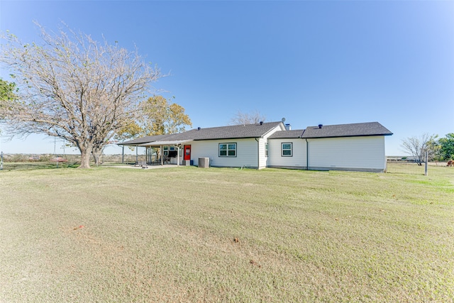 back of house with a yard and a carport