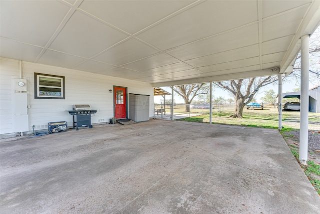 view of patio / terrace featuring a grill and a carport