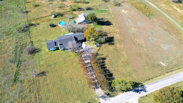 birds eye view of property with a rural view