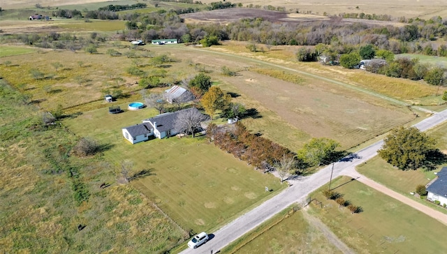 birds eye view of property with a rural view