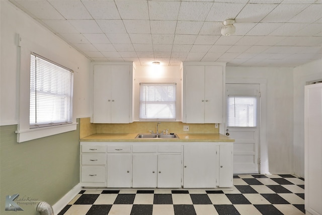 kitchen with sink and white cabinets