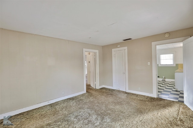 unfurnished bedroom with carpet flooring