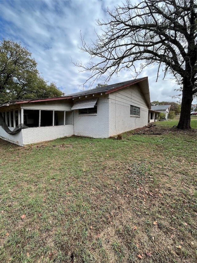 view of home's exterior featuring a yard