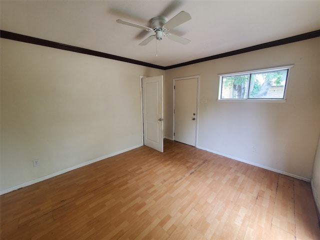 unfurnished room featuring ceiling fan, light hardwood / wood-style flooring, and crown molding