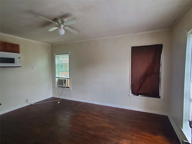 spare room featuring ornamental molding, ceiling fan, cooling unit, and dark hardwood / wood-style floors