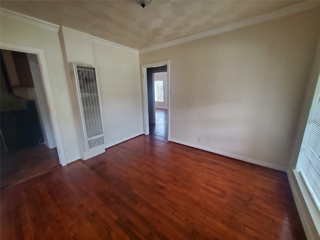 unfurnished room with dark wood-type flooring and crown molding