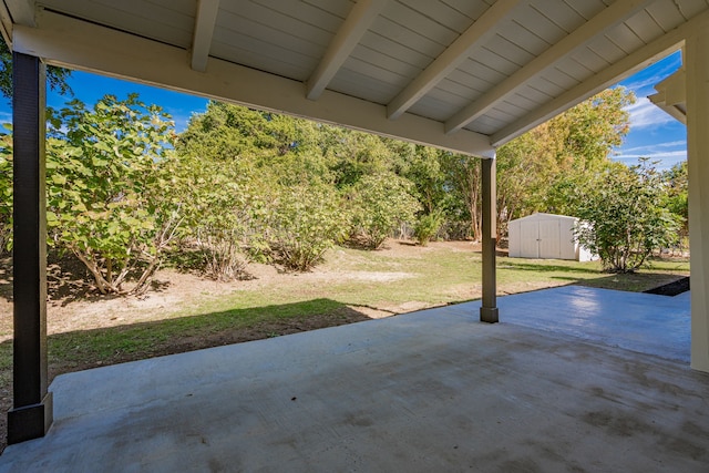 view of patio with a storage unit