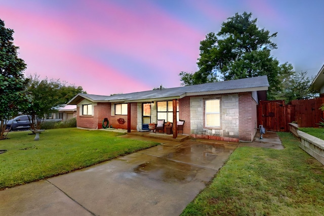 ranch-style house with a yard