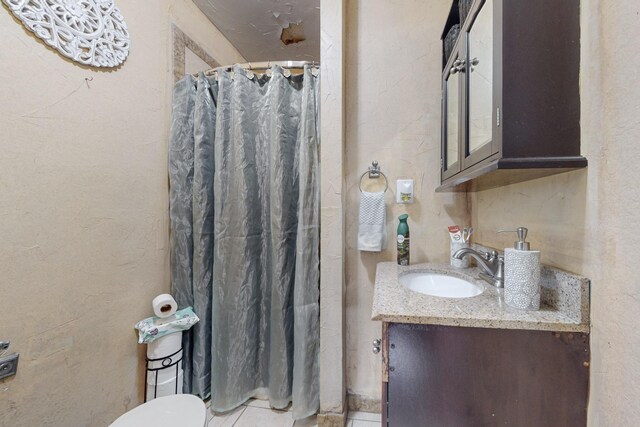 bathroom featuring vanity and a shower with shower curtain