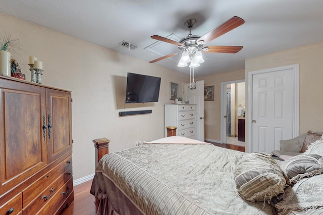 bedroom featuring ceiling fan and dark hardwood / wood-style floors