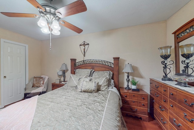 bedroom featuring dark hardwood / wood-style flooring and ceiling fan