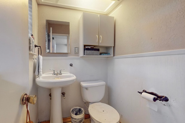 bathroom with sink and toilet