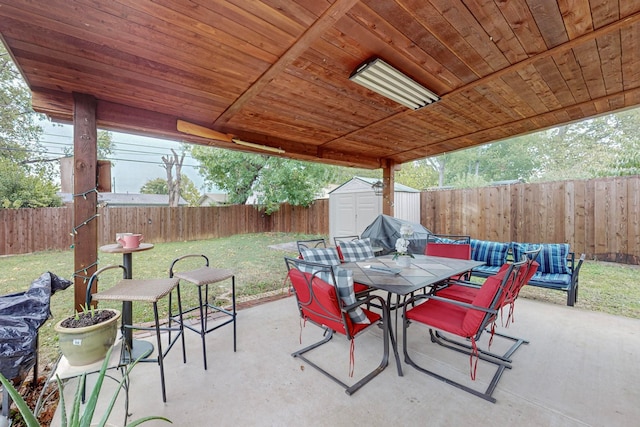 view of patio featuring a storage unit