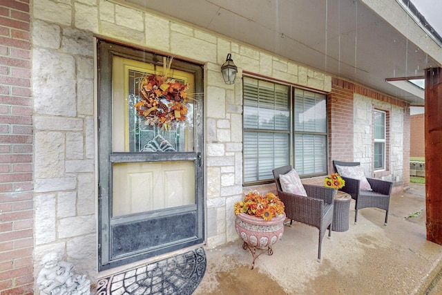 doorway to property featuring an outdoor living space