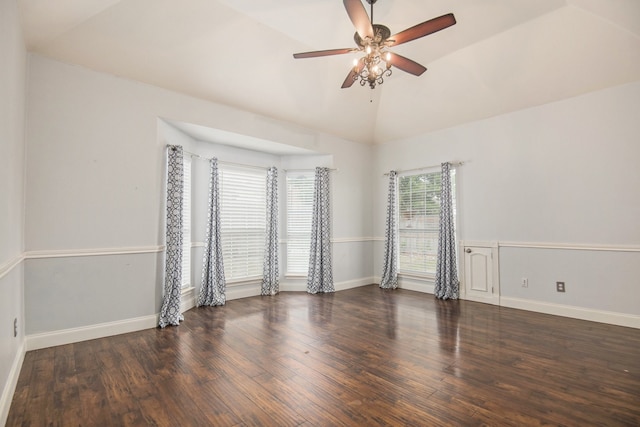 spare room featuring lofted ceiling, dark wood-type flooring, and ceiling fan