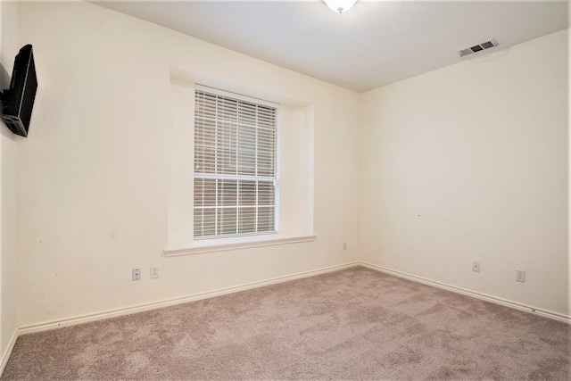 unfurnished room featuring carpet flooring