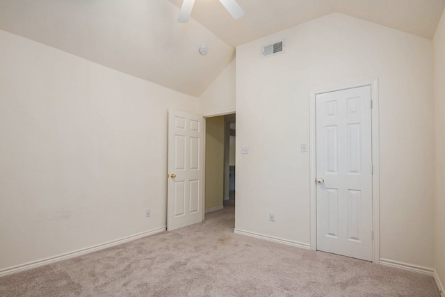 unfurnished bedroom with vaulted ceiling, light carpet, and ceiling fan