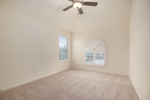 unfurnished room featuring light colored carpet and ceiling fan