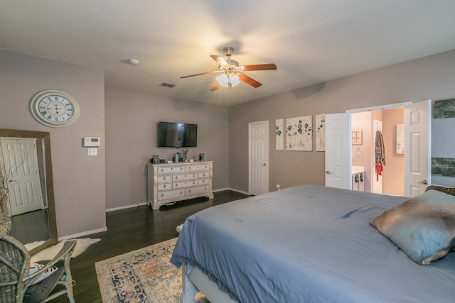 bedroom with ensuite bath, ceiling fan, and dark hardwood / wood-style floors