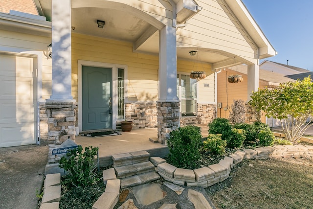 doorway to property featuring a porch