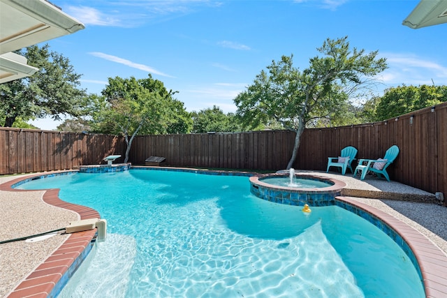 view of swimming pool with an in ground hot tub