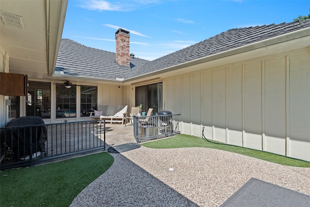 exterior space with ceiling fan and a patio