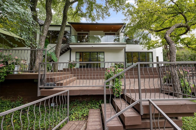 rear view of house with a deck