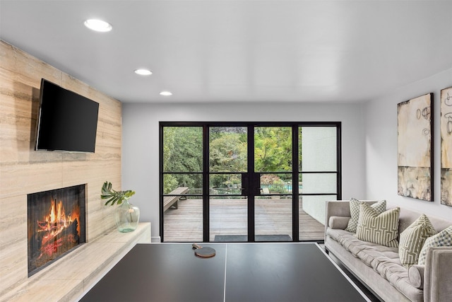 living room featuring a fireplace