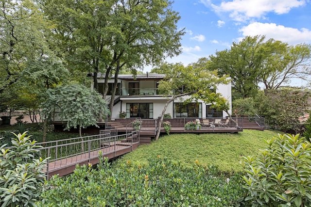 2103 Indian Creek Dr, Westover Hills, TX 76107 - back of house with a lawn, a balcony, and stucco siding